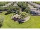 Overhead view of a modern playground with shade structures and walking paths in a green neighborhood park at 3252 E Lexington Ave, Gilbert, AZ 85234