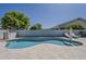 Backyard swimming pool with lounge chairs and large umbrella, ideal for backyard fun and relaxation at 3252 E Lexington Ave, Gilbert, AZ 85234