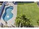 Overhead shot of a clean swimming pool with an adjacent well-manicured lawn at 3252 E Lexington Ave, Gilbert, AZ 85234