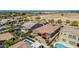 Backyard aerial view of a home with lawn and patio area, plus neighboring home and community pools at 3269 E Ironside Ln, Gilbert, AZ 85298