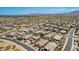 Extensive community aerial view with many homes under a blue sky, plus community streets at 3269 E Ironside Ln, Gilbert, AZ 85298