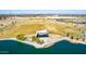 Stunning aerial view showcases the community park and lake with a modern architectural feature at 3269 E Ironside Ln, Gilbert, AZ 85298