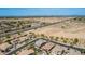 An aerial view showcasing the neighborhood, nearby road, and expansive desert landscape at 3269 E Ironside Ln, Gilbert, AZ 85298
