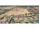 An aerial view displays the beautiful community, highlighting the vacant lot, scenic ponds, and well-maintained streets at 3269 E Ironside Ln, Gilbert, AZ 85298