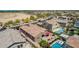 Aerial view of backyard with lawn and patio area, plus neighboring homes with swimming pools at 3269 E Ironside Ln, Gilbert, AZ 85298