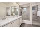 Bathroom featuring double sinks, granite counters, ample cabinetry and a spacious shower at 3269 E Ironside Ln, Gilbert, AZ 85298