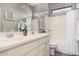 Bathroom featuring a double sink vanity, decorative accents, and shower/tub combo at 3269 E Ironside Ln, Gilbert, AZ 85298