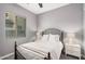 Charming bedroom features a wrought iron bed frame and soft, neutral decor at 3269 E Ironside Ln, Gilbert, AZ 85298