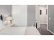 Bedroom featuring gray walls, tile floors, carpeted floors, closet with sliding doors, and neutral furniture at 3269 E Ironside Ln, Gilbert, AZ 85298