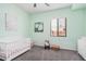 Inviting bedroom with ample natural light, decorated with mint green paint and white trim at 3269 E Ironside Ln, Gilbert, AZ 85298