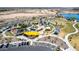 This aerial view showcases the community park's splash pad, playground, parking, and recreation areas at 3269 E Ironside Ln, Gilbert, AZ 85298
