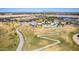 Aerial view of a community park featuring winding pathways, lush green lawns, and a splash pad at 3269 E Ironside Ln, Gilbert, AZ 85298