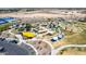 An aerial view showing a vibrant community park with playground, splash pad, and shaded picnic areas at 3269 E Ironside Ln, Gilbert, AZ 85298