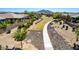 A beautifully landscaped community walkway with lush greenery and rock accents at 3269 E Ironside Ln, Gilbert, AZ 85298