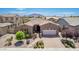Charming single-story home featuring a tiled roof, landscaped front yard, and a two-car garage at 3269 E Ironside Ln, Gilbert, AZ 85298