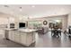 Open-concept kitchen with a large island, stainless steel appliances, and adjacent dining area at 3269 E Ironside Ln, Gilbert, AZ 85298