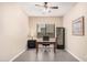 Functional home office with a desk, comfortable chair, wine fridge and natural light at 3269 E Ironside Ln, Gilbert, AZ 85298