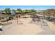 The image shows the park's playground, which features modern play structures and ample space for to enjoy at 3269 E Ironside Ln, Gilbert, AZ 85298