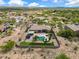 Desert estate with a private backyard, including a pool, trampoline, and custom landscaping, aerial view at 3816 E El Sendero Rd, Cave Creek, AZ 85331