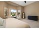 Serene bedroom with a view of the garden, sitting area, and stylish furnishings, creating a relaxing atmosphere at 3816 E El Sendero Rd, Cave Creek, AZ 85331