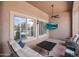 Relaxing patio with wicker furniture, ceiling fan, mounted flatscreen TV, and neutral color palette at 3816 E El Sendero Rd, Cave Creek, AZ 85331