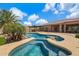 Backyard oasis featuring a sparkling pool, spa, covered patio, and desert landscaping, perfect for outdoor entertaining at 3816 E El Sendero Rd, Cave Creek, AZ 85331