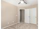 Neutral bedroom with carpeted floors, bright natural light, and a closet with sliding doors at 3994 E Maplewood St, Gilbert, AZ 85297