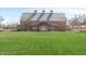 A charming barn-style community building set against a bright blue sky and lush green lawn at 3994 E Maplewood St, Gilbert, AZ 85297