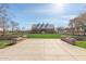 Exterior shot of a barn-style building with a well-manicured lawn and symmetrical hardscape at 3994 E Maplewood St, Gilbert, AZ 85297