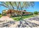 Exterior view of a spacious clubhouse featuring a covered porch and well-maintained landscaping at 3994 E Maplewood St, Gilbert, AZ 85297