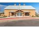 Exterior of the community center featuring covered entrance and ample parking at 3994 E Maplewood St, Gilbert, AZ 85297