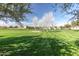 Expansive view of a community park with walking paths, picnic areas and mature trees at 3994 E Maplewood St, Gilbert, AZ 85297