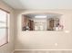 Cozy dining area offers an open view into the kitchen through a pass-through window at 3994 E Maplewood St, Gilbert, AZ 85297