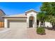 Charming single-story home featuring a neutral color palette, arched entry, and a well-manicured landscape at 3994 E Maplewood St, Gilbert, AZ 85297