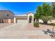Attractive single-story home with a tiled roof, attached garage, and well-kept landscaping at 3994 E Maplewood St, Gilbert, AZ 85297