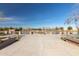 Scenic view of the community pond with a symmetrical walkway and decorative brick accents under a bright sky at 3994 E Maplewood St, Gilbert, AZ 85297