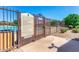 Community pool area featuring pool rules sign with fenced in pool with landscaping at 3994 E Maplewood St, Gilbert, AZ 85297