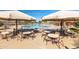 Community pool featuring shaded seating areas and colorful water features for outdoor enjoyment at 3994 E Maplewood St, Gilbert, AZ 85297