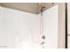 Clean shower featuring a white tiled surround, adjustable shower head, and well-maintained fixtures at 3994 E Maplewood St, Gilbert, AZ 85297