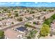 Expansive aerial view of a vibrant neighborhood with well-maintained homes, lush landscaping, and community amenities at 4061 W Tonopah Dr, Glendale, AZ 85308
