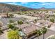 Scenic aerial view showcasing the community, nearby mountains and backyard pool at 4061 W Tonopah Dr, Glendale, AZ 85308