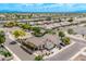 Aerial view of a well-maintained home featuring mature landscaping, a private pool, and a convenient two-car garage at 4061 W Tonopah Dr, Glendale, AZ 85308