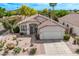 Inviting home with desert landscaping, covered entry, and a spacious two-car garage at 4061 W Tonopah Dr, Glendale, AZ 85308