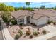 Attractive single-story home with desert landscaping and a convenient two-car garage at 4061 W Tonopah Dr, Glendale, AZ 85308