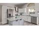 Modern kitchen featuring white cabinets, stainless steel appliances, and granite countertops at 4061 W Tonopah Dr, Glendale, AZ 85308
