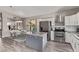 Contemporary kitchen layout with stainless steel appliances and center island at 4061 W Tonopah Dr, Glendale, AZ 85308