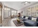 Bright living room featuring plantation shutters, vaulted ceilings, and wood floors at 4061 W Tonopah Dr, Glendale, AZ 85308
