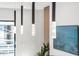 Modern dining area featuring striking pendant lighting and a decorative ocean-themed art piece at 4220 N 32Nd St # 39, Phoenix, AZ 85018