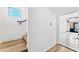 Hallway with light wood floors and access to a garage or storage area at 4220 N 32Nd St # 39, Phoenix, AZ 85018