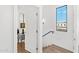 Hallway with a view of a bedroom, wood stairs and a modern window with city views at 4220 N 32Nd St # 39, Phoenix, AZ 85018